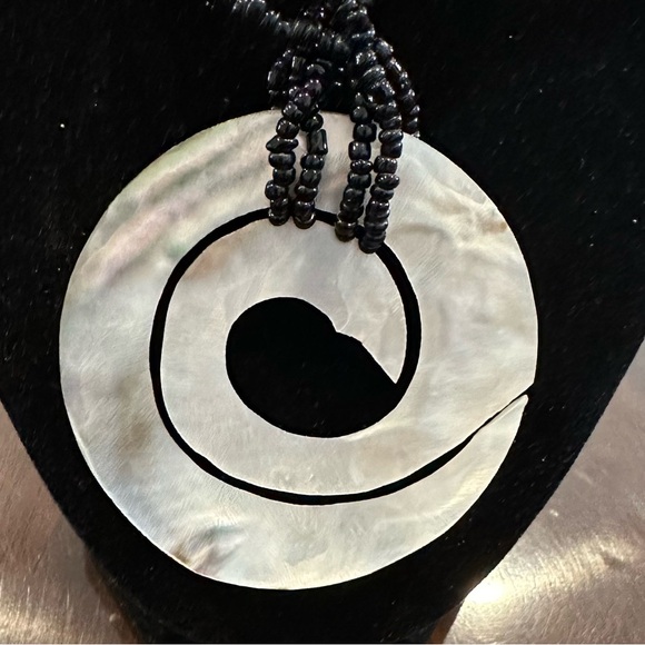 Iridescent White Mother Of Pearl Pendant
With Black Beads - Picture 3 of 3